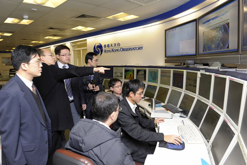 NMC Delegates familiarizing themselves with the operation of the Hong Kong Meteorological Center at the Observatory.