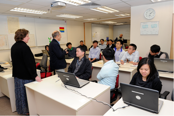 Mr. James Wilson and Ms. Rita Roberts conducting lab exercise on mesoscale weather analysis with HKO colleagues.