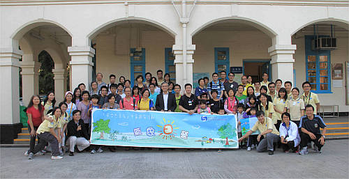 The Director (center) photographed with FoOb members