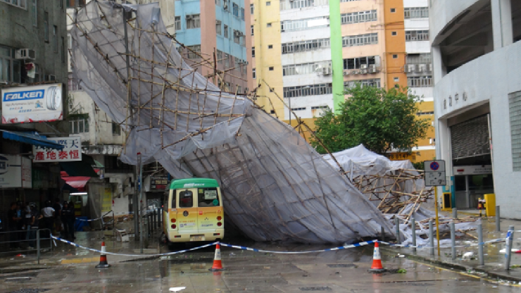 Fig.5 A scaffolding at Ta Chuen Ping Street of Kwai Chung collapsed, damaging a lorry and a minibus during the passage of Typhoon Kalmaegi. (Photo courtesy of Sing Tao Daily)